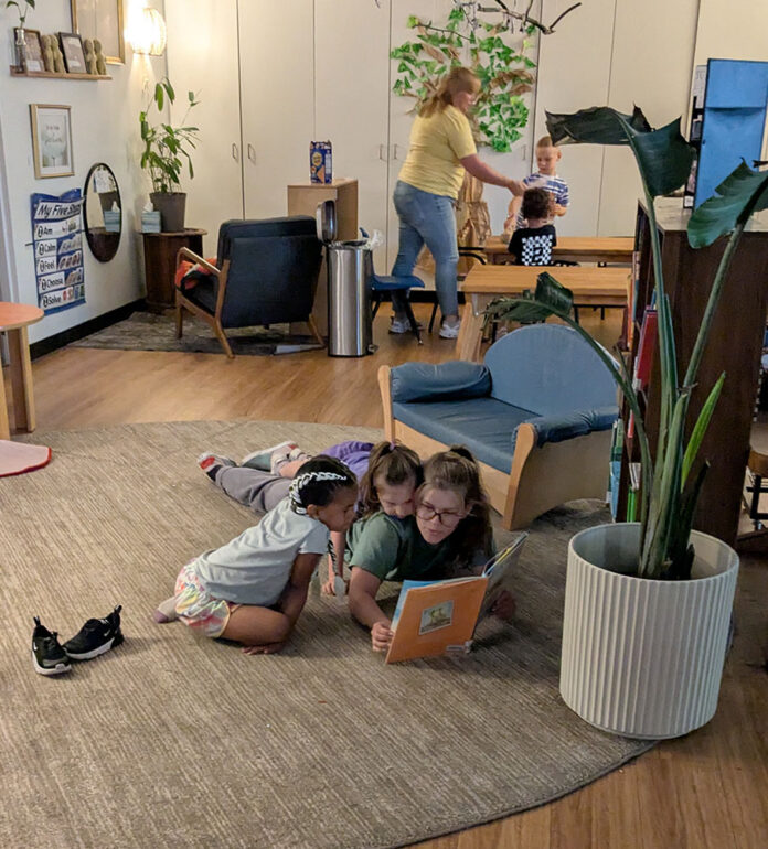Miss Riley reads to Margaret, 4, and Baylor. (TFP Photo/Mary Helen DeLisle)