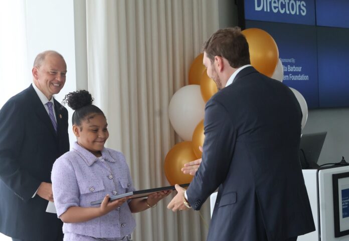 TMA director Adam Levine accepts a proclamation from Mayor and Kid Mayor